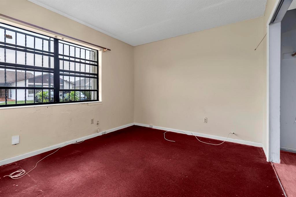 602 Southwest 99th Place Miami, FL 33174 - Photo 29 of 42 an empty room with a window