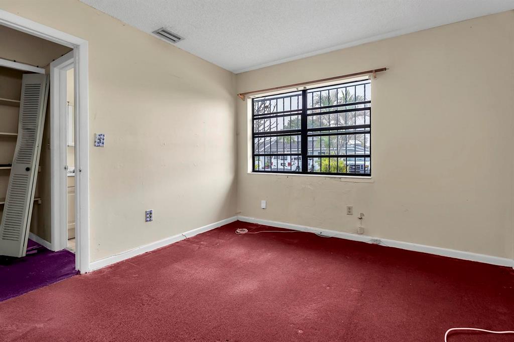 602 Southwest 99th Place Miami, FL 33174 - Photo 30 of 42 an empty room with windows
