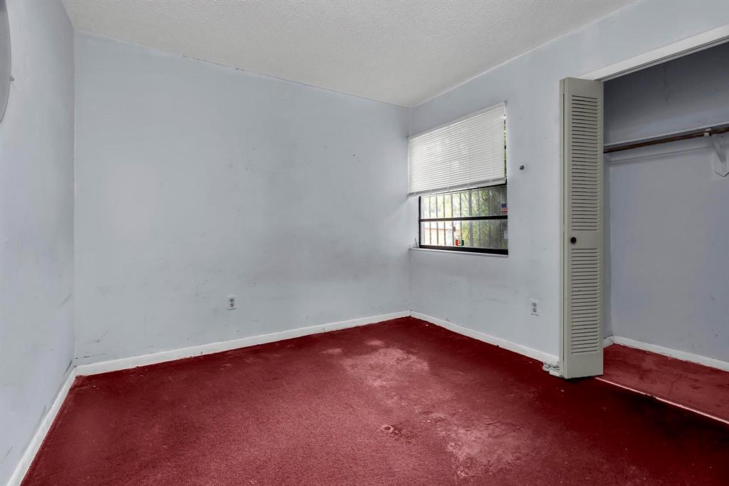 602 Southwest 99th Place Miami, FL 33174 - Photo 32 of 42 an empty room with a window
