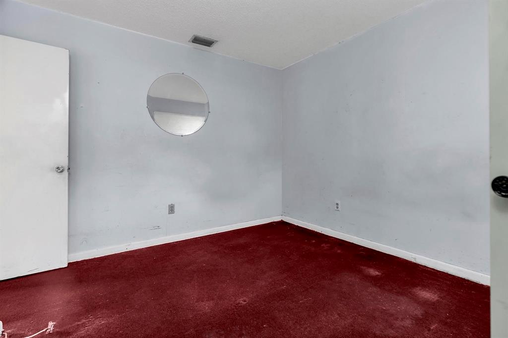 602 Southwest 99th Place Miami, FL 33174 - Photo 34 of 42 an empty room with wooden floor and windows