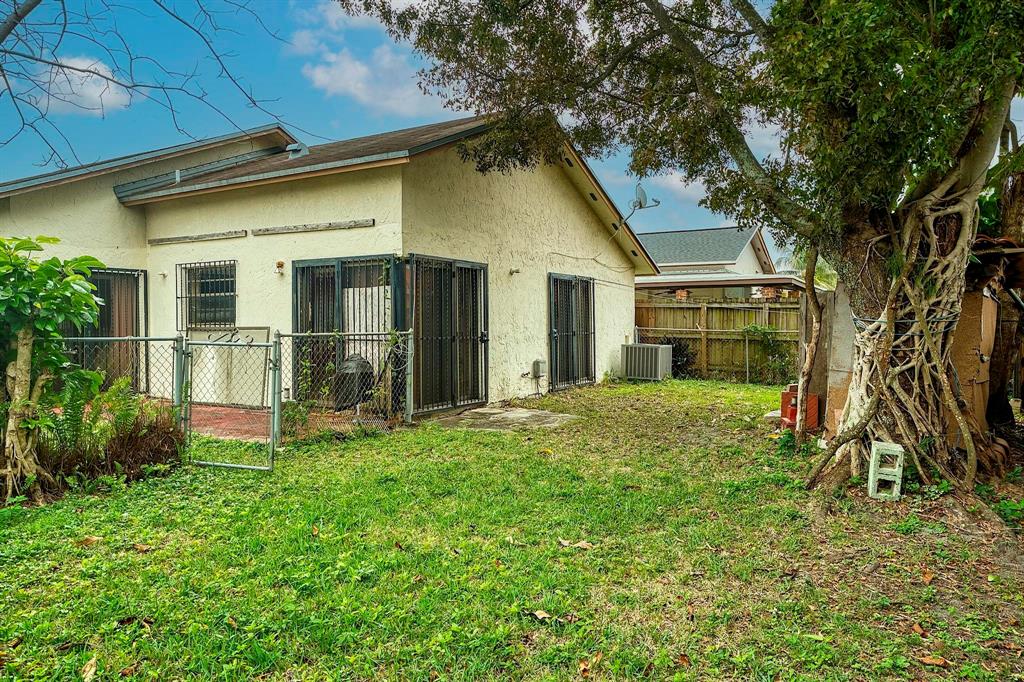602 Southwest 99th Place Miami, FL 33174 - Photo 39 of 42 a view of a house with a yard
