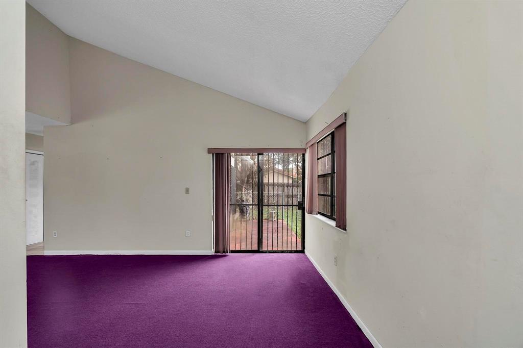 602 Southwest 99th Place Miami, FL 33174 - Photo 4 of 42 a view of an empty room with a window