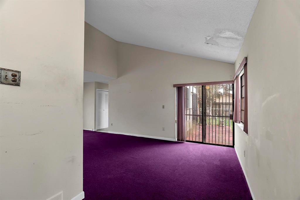 602 Southwest 99th Place Miami, FL 33174 - Photo 5 of 42 an empty room with windows