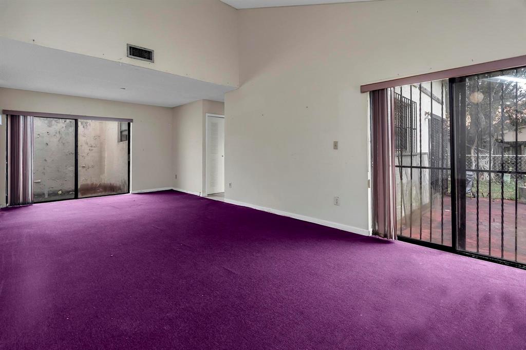 602 Southwest 99th Place Miami, FL 33174 - Photo 6 of 42 a view of empty room with floor to ceiling windows