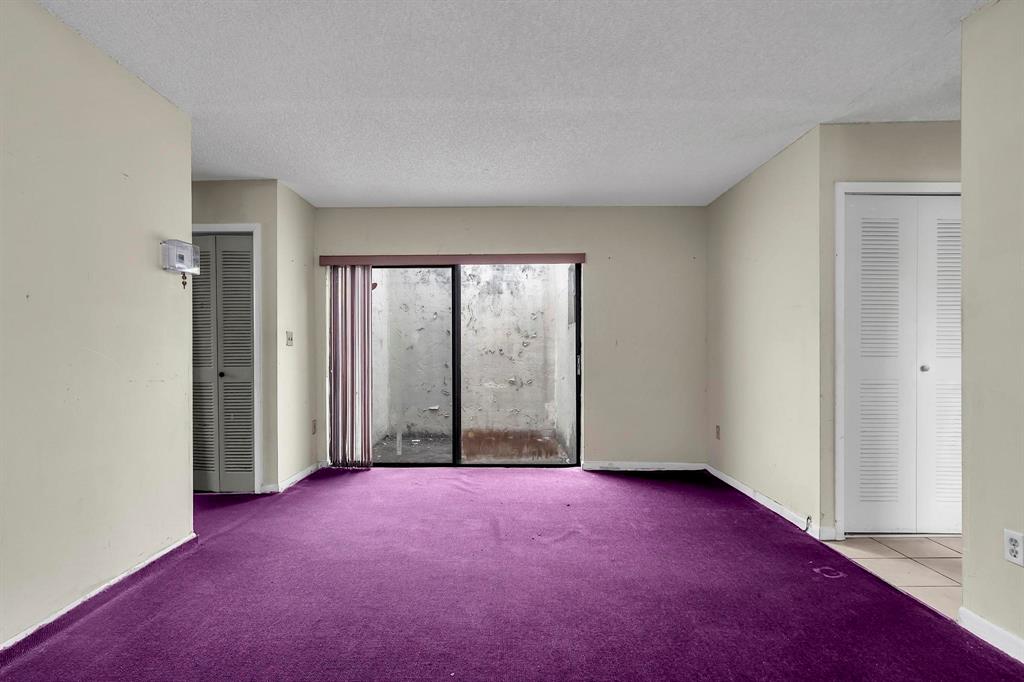 602 Southwest 99th Place Miami, FL 33174 - Photo 7 of 42 an empty room with window