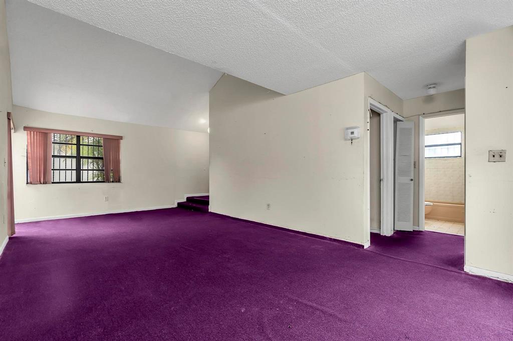 602 Southwest 99th Place Miami, FL 33174 - Photo 8 of 42 an empty room with windows and entrance