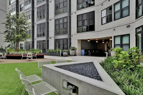 a view of swimming pool with outdoor seating