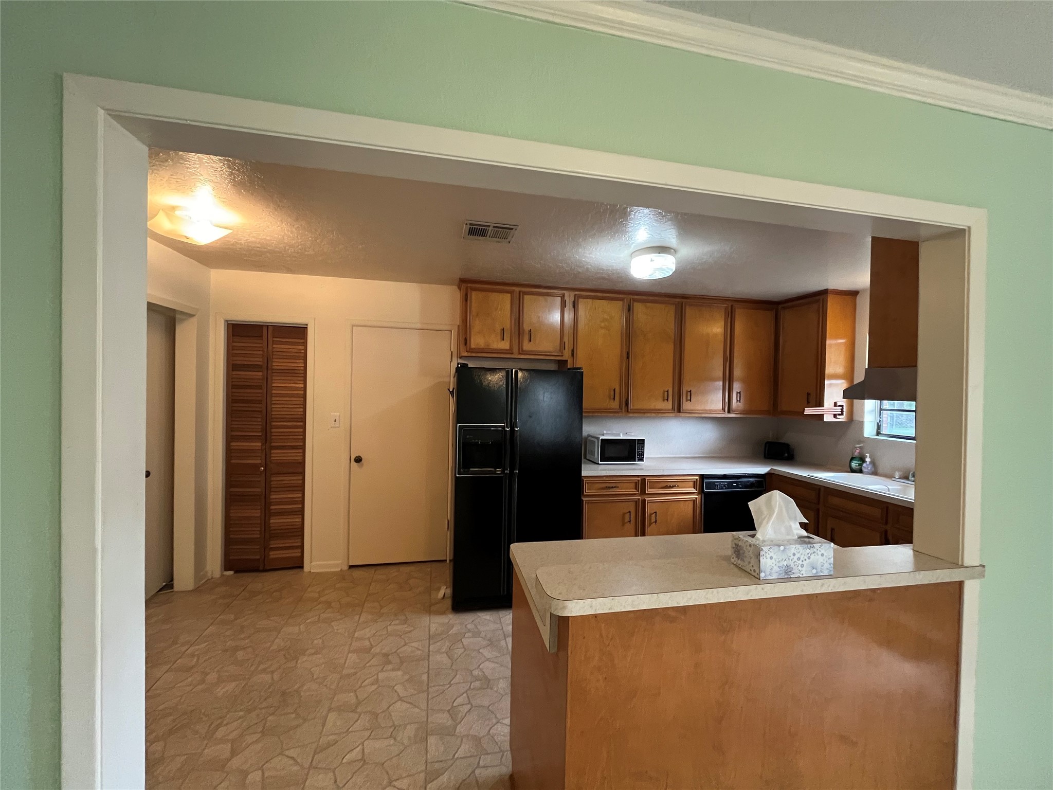1475 Cr 16 Road Garwood, TX 77442 - Photo 2 of 43 a kitchen with a refrigerator and a sink