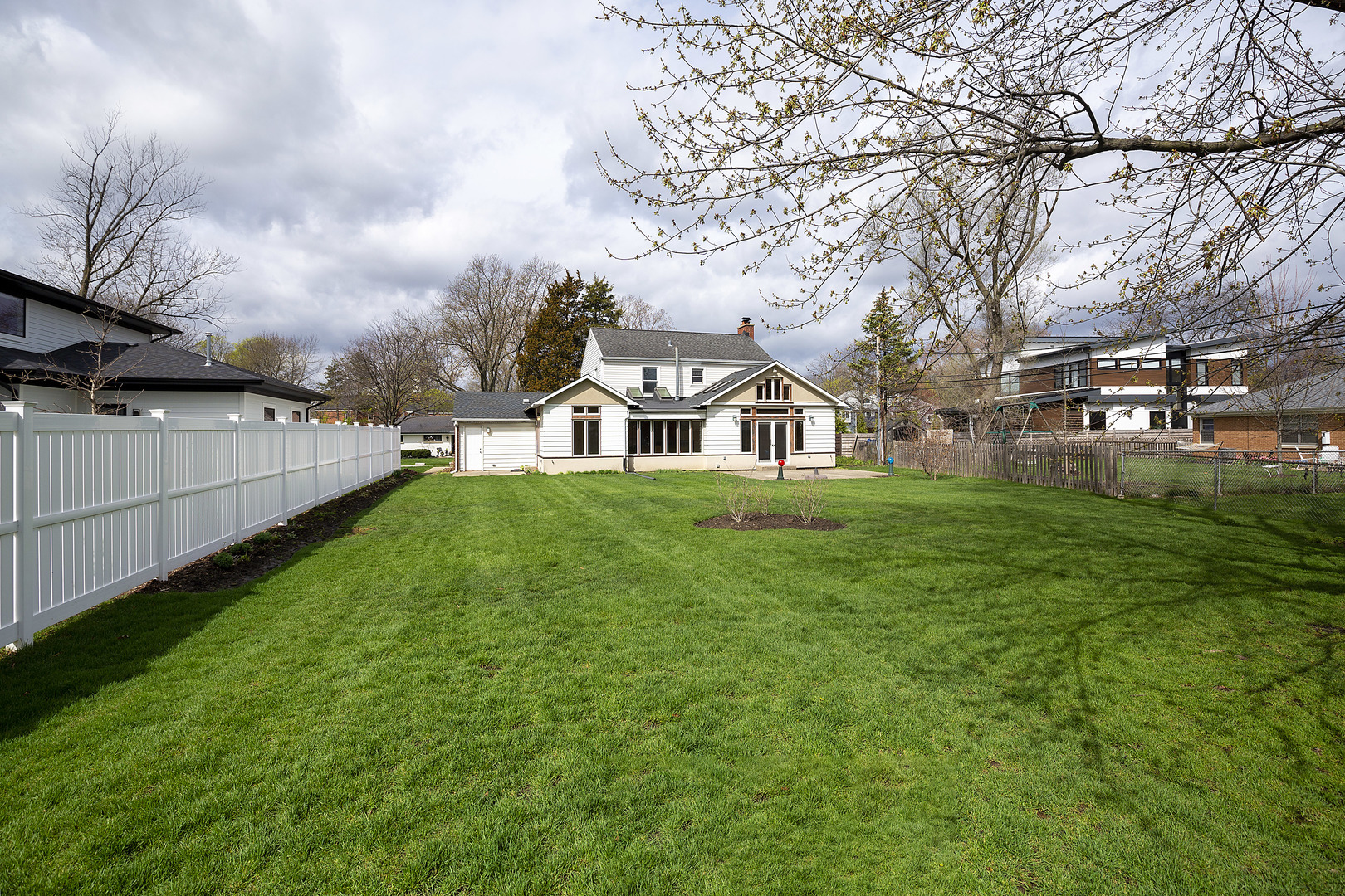 1021 Linden Leaf Drive Glenview, IL 60025 - Photo 2 of 2 a front view of a house with garden