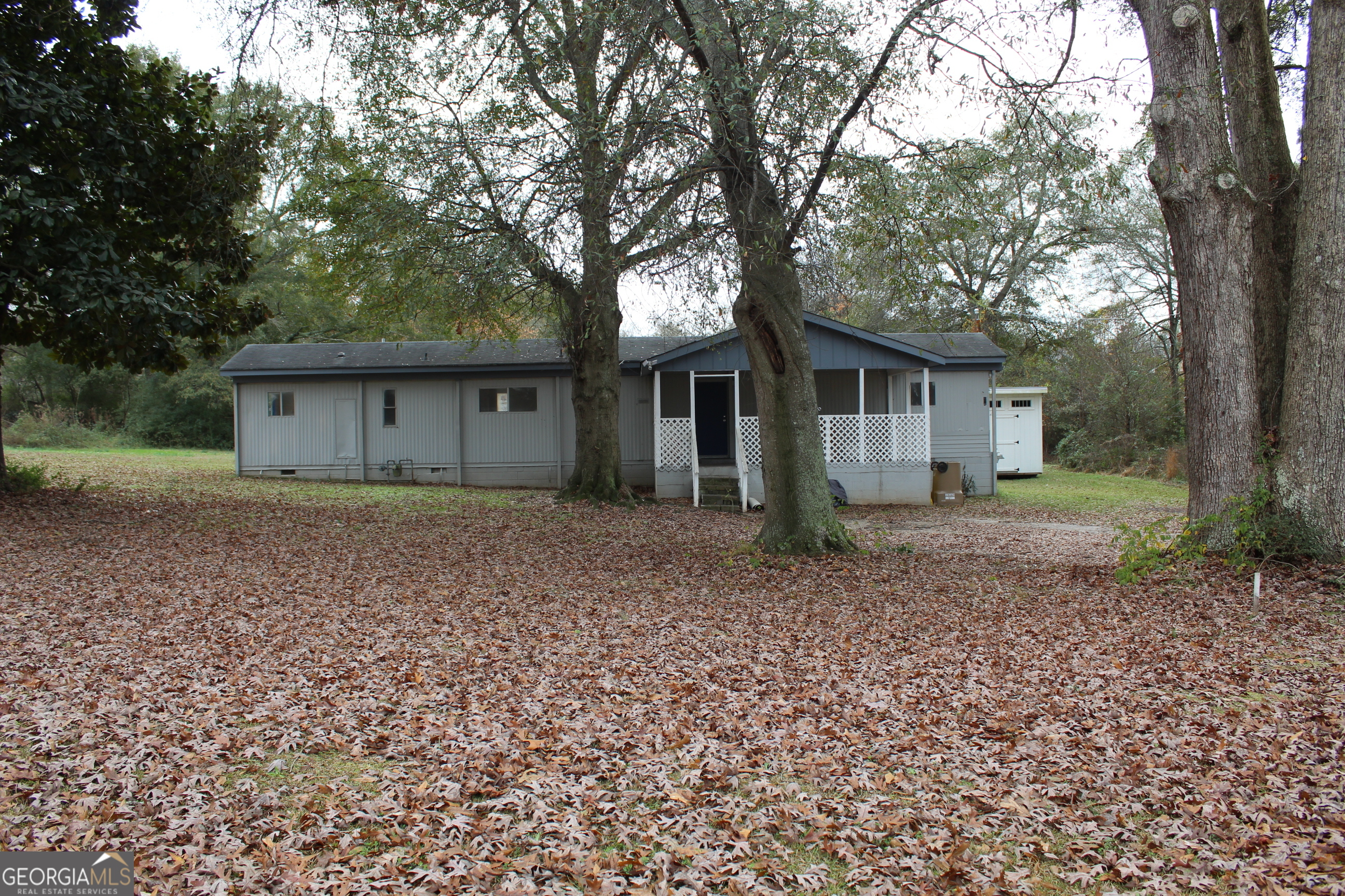 220 Carl Bethlehem Road Southwest Bethlehem, GA 30620 - Photo 1 of 11 a view of house with a garden