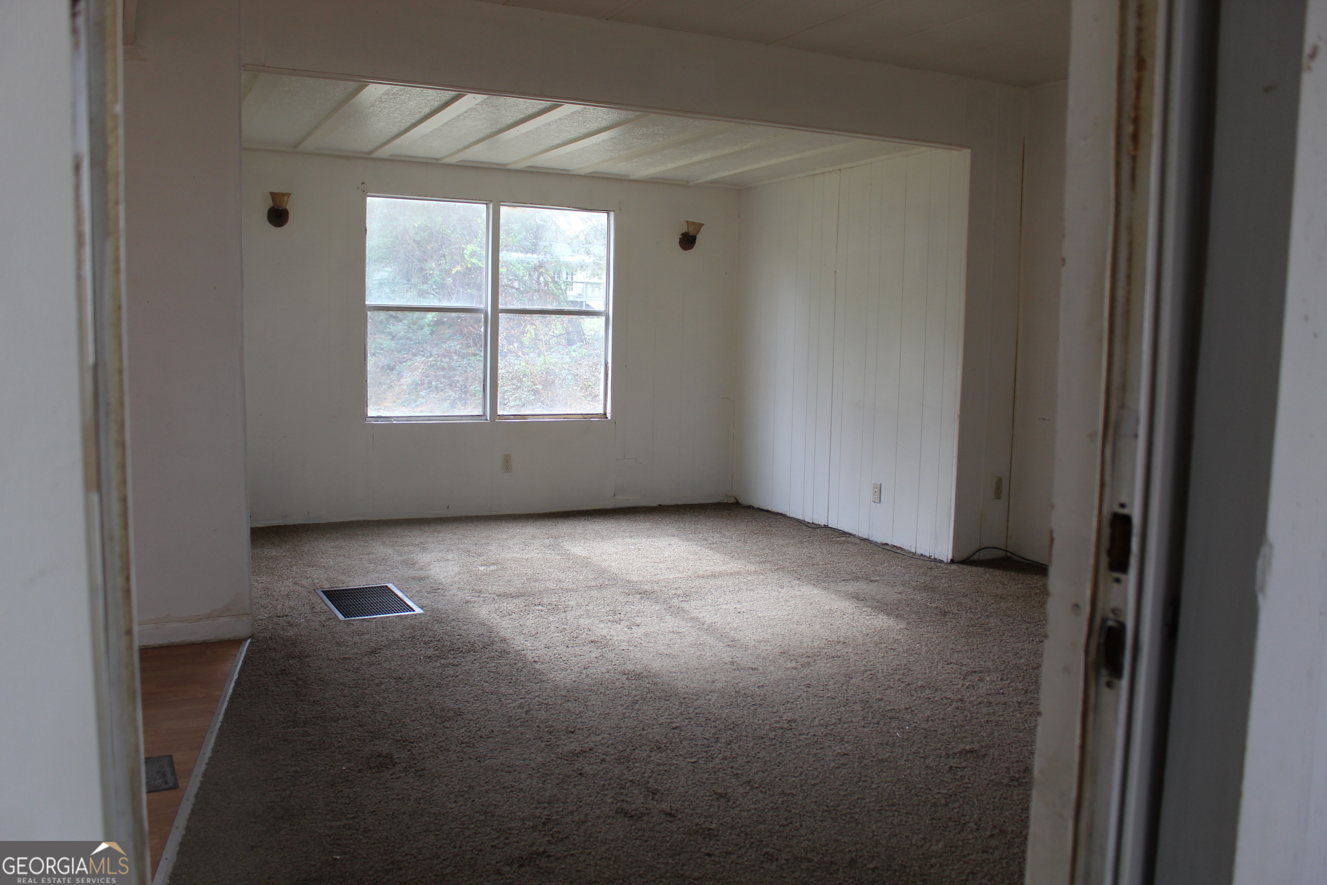 220 Carl Bethlehem Road Southwest Bethlehem, GA 30620 - Photo 3 of 11 an empty room with windows
