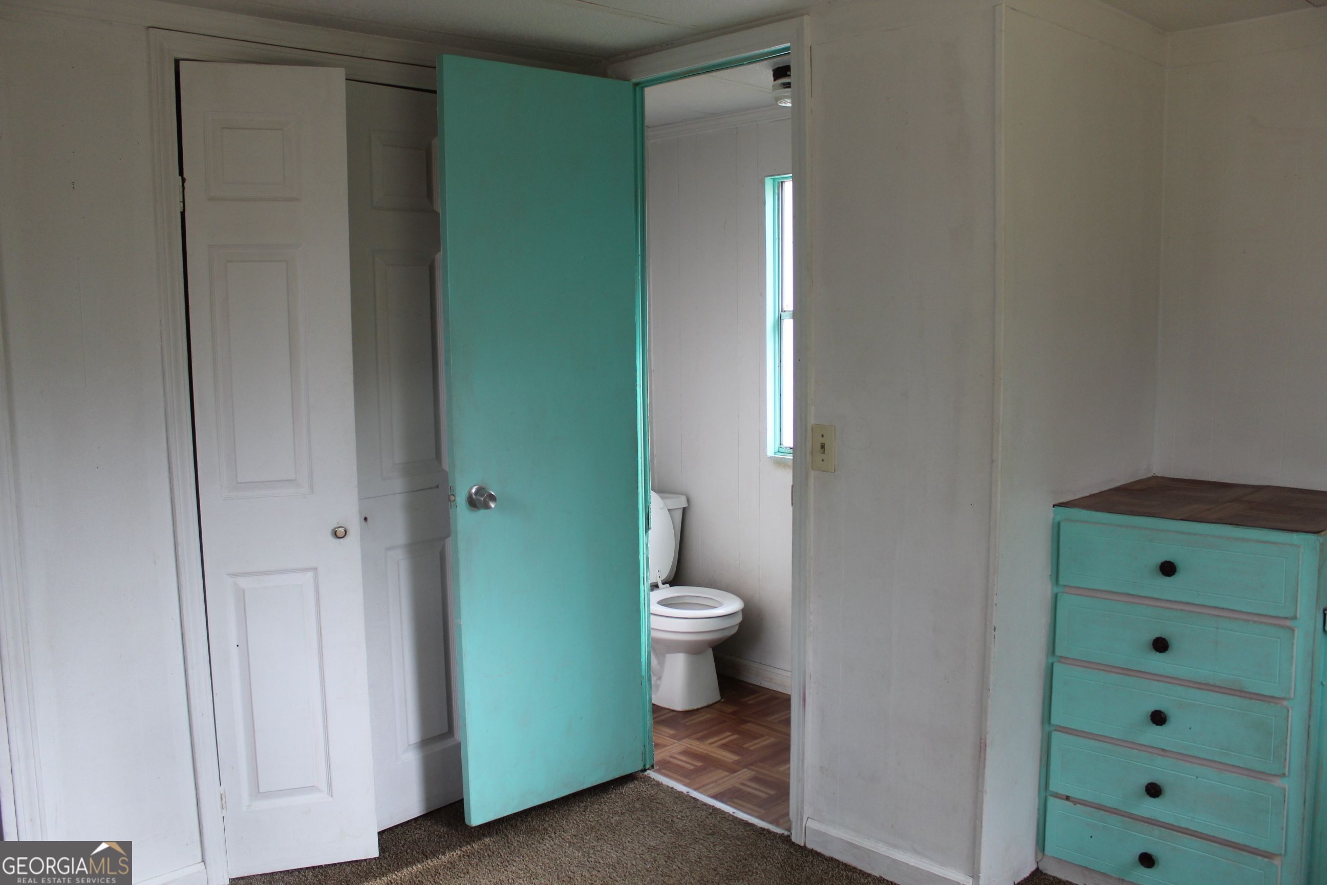 220 Carl Bethlehem Road Southwest Bethlehem, GA 30620 - Photo 6 of 11 a bathroom with a toilet and a sink