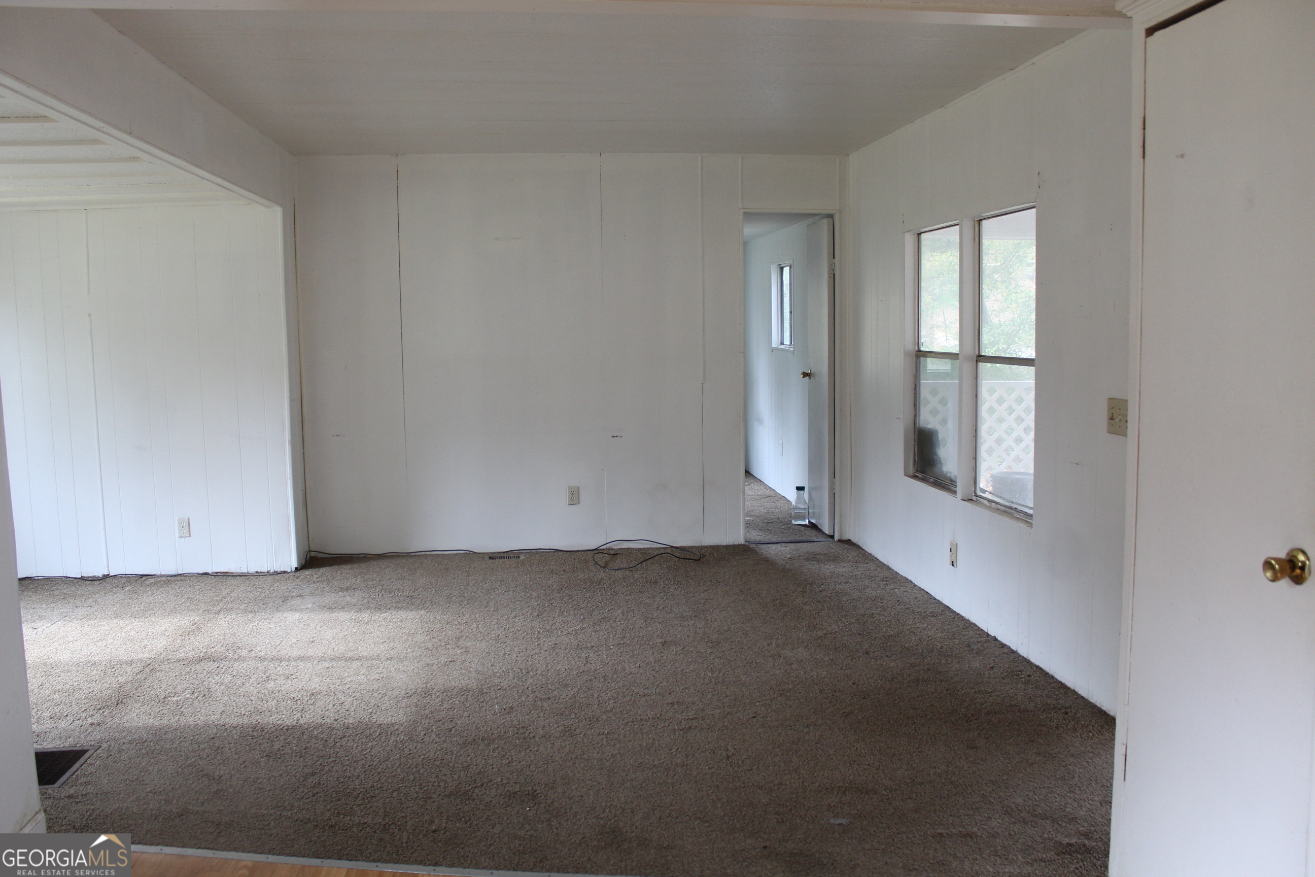 220 Carl Bethlehem Road Southwest Bethlehem, GA 30620 - Photo 7 of 11 an empty room with windows