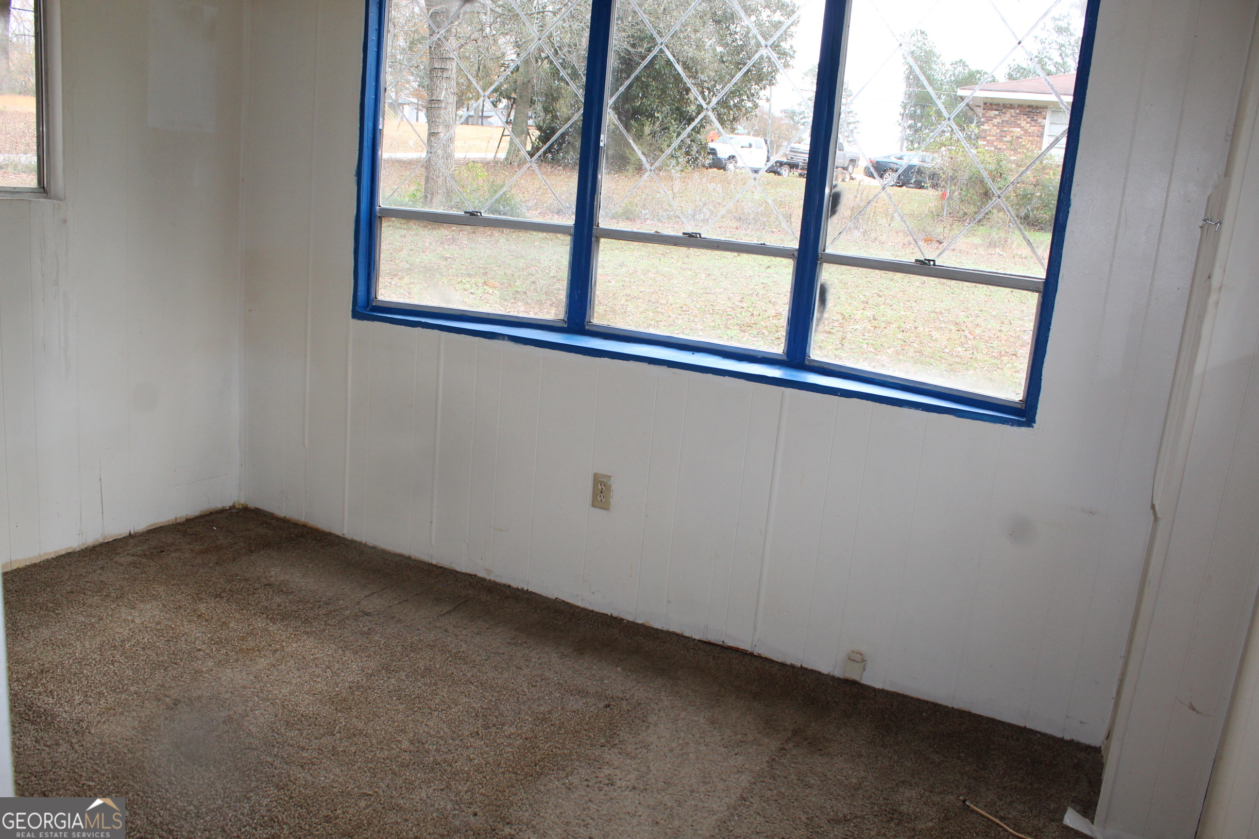 220 Carl Bethlehem Road Southwest Bethlehem, GA 30620 - Photo 9 of 11 an empty room with a window