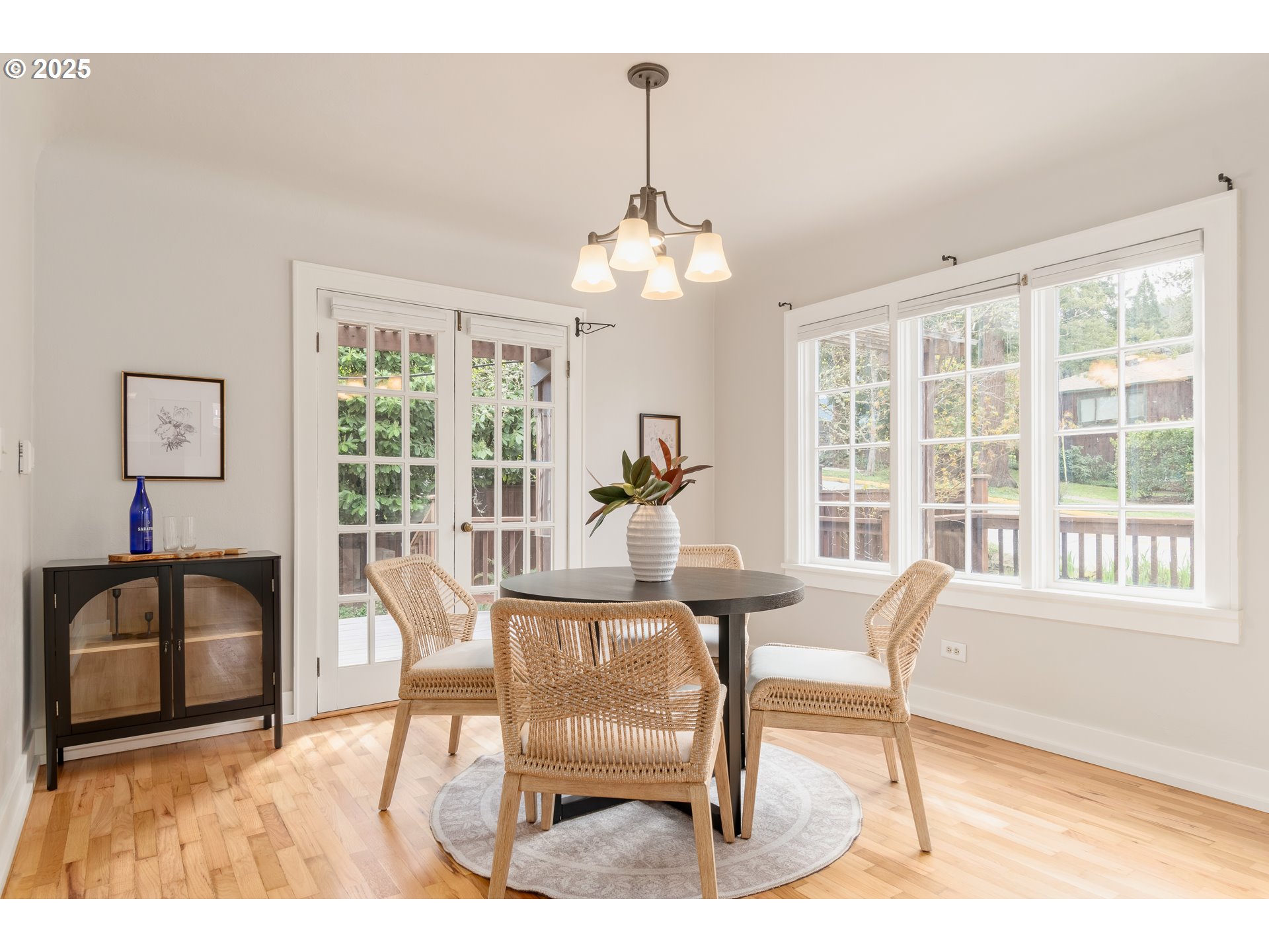 2033 East 19th Avenue Eugene, OR 97403 - Photo 11 of 45 a dining room with furniture a chandelier and wooden floor