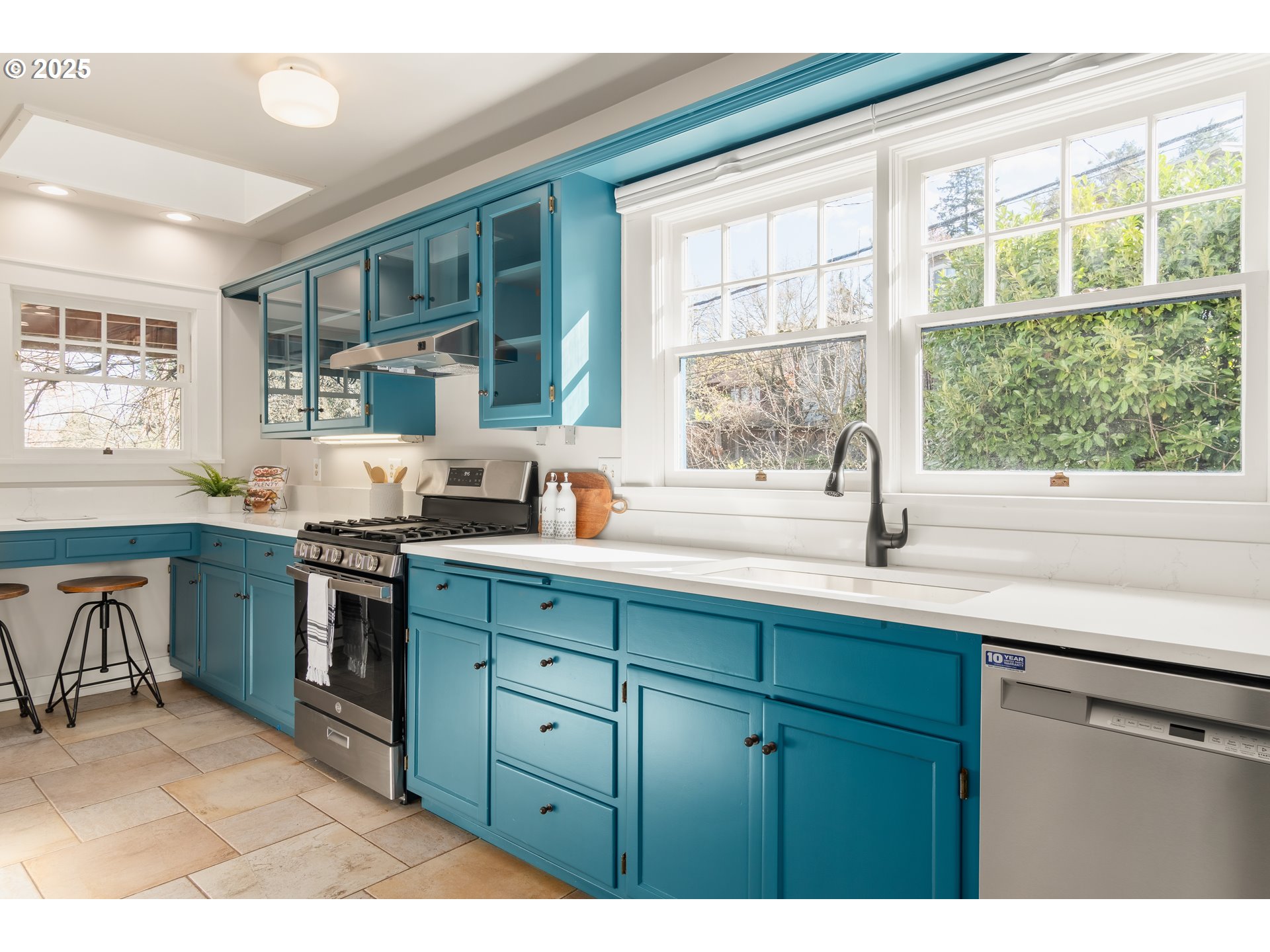 2033 East 19th Avenue Eugene, OR 97403 - Photo 14 of 45 a kitchen with a sink stove and cabinets