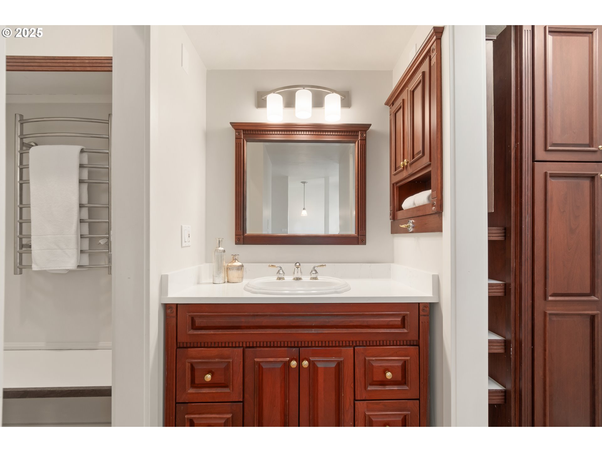 2033 East 19th Avenue Eugene, OR 97403 - Photo 29 of 45 a bathroom with a sink and a mirror