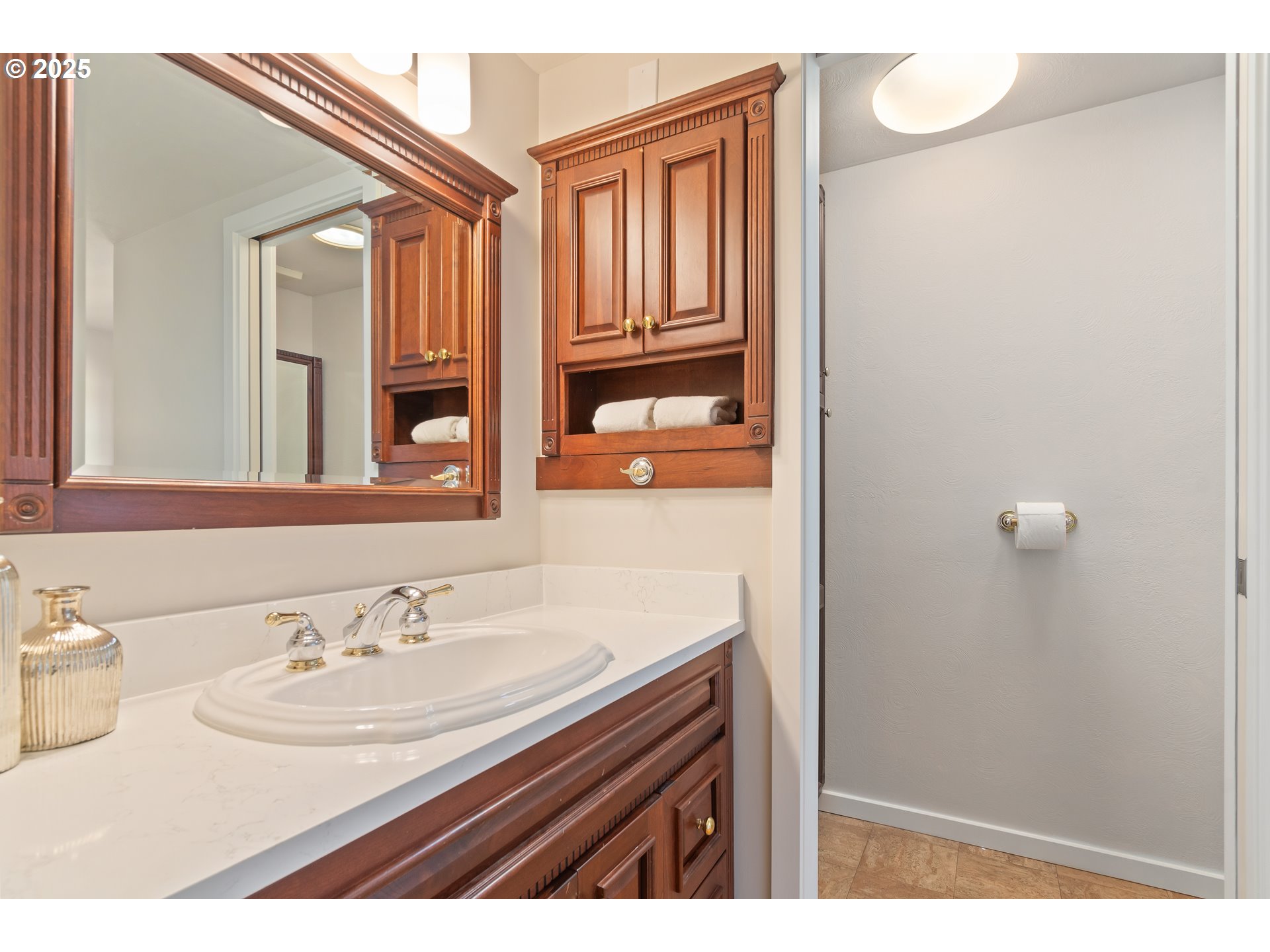 2033 East 19th Avenue Eugene, OR 97403 - Photo 31 of 45 a bathroom with a sink and a mirror