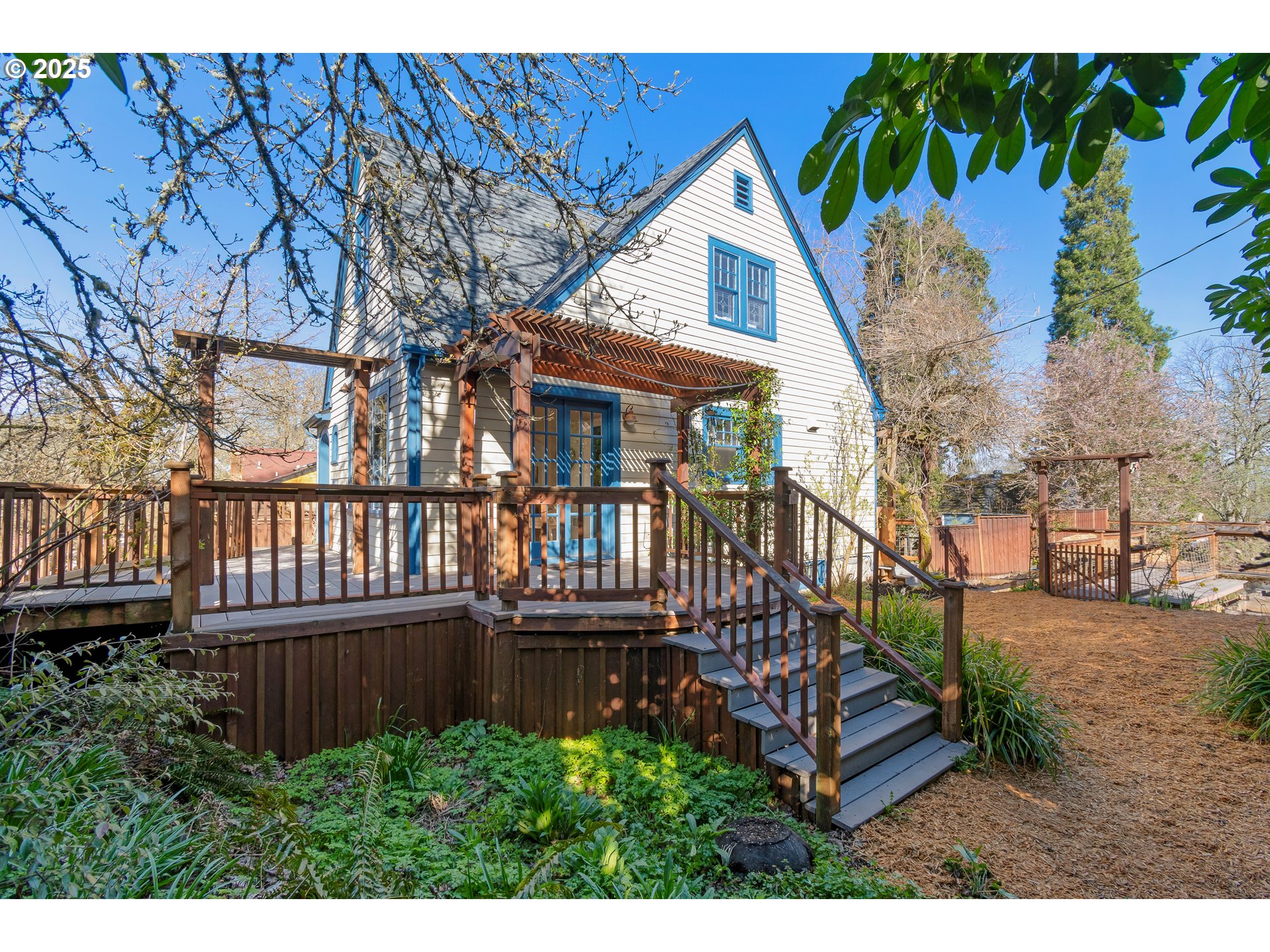 2033 East 19th Avenue Eugene, OR 97403 - Photo 38 of 45 a view of a house with wooden deck front of house