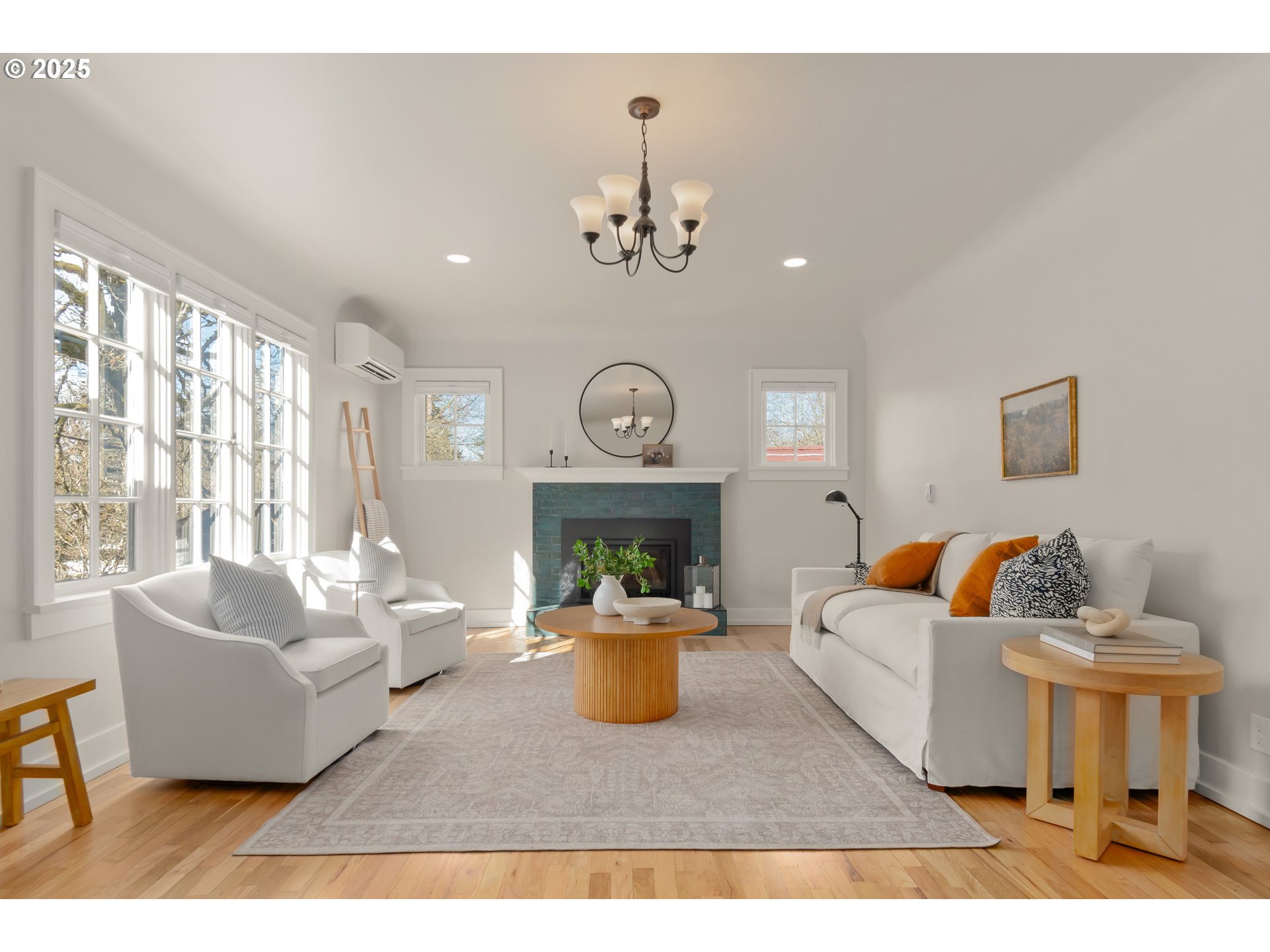 2033 East 19th Avenue Eugene, OR 97403 - Photo 6 of 45 a living room with furniture a chandelier and a window
