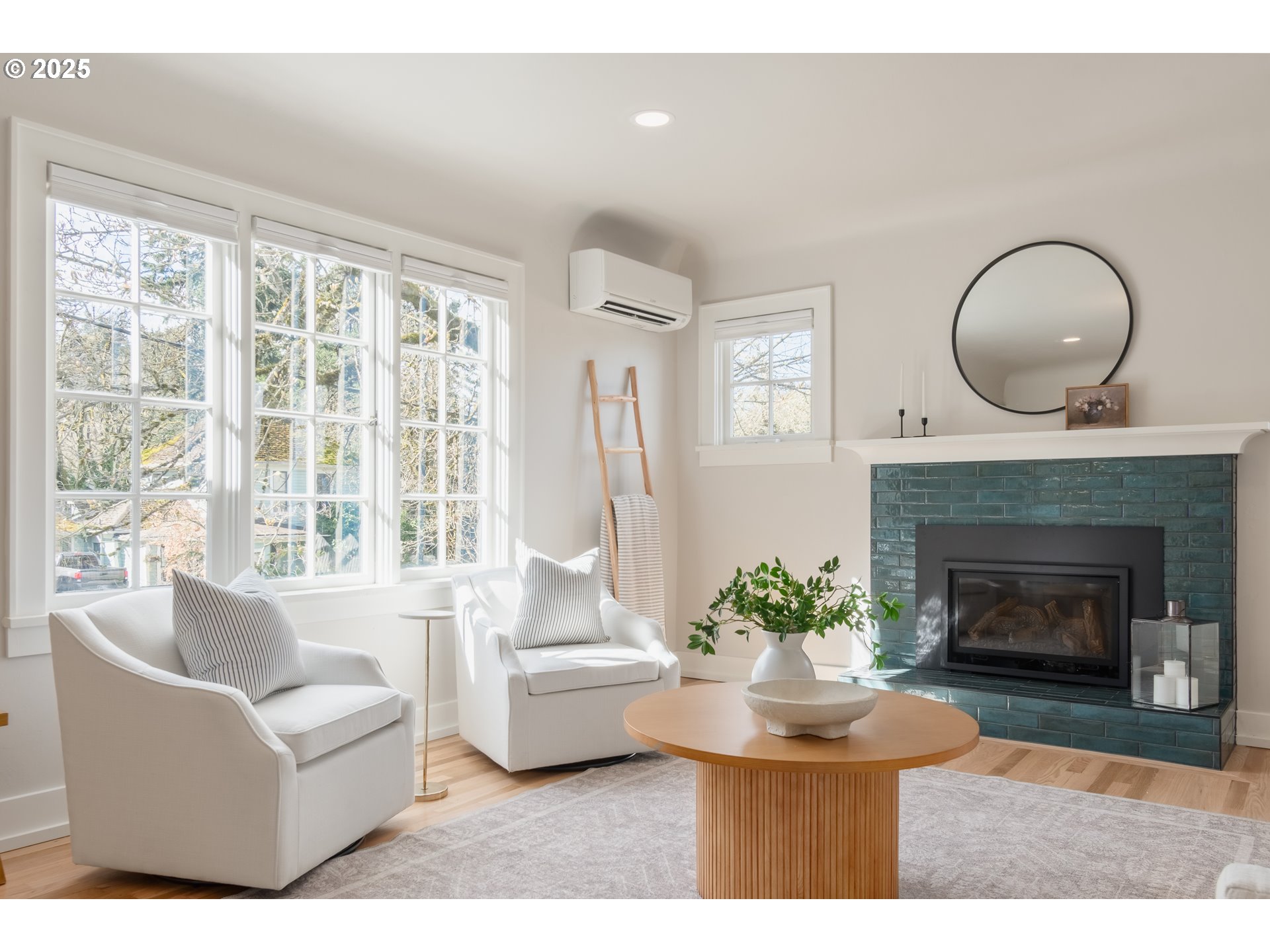 2033 East 19th Avenue Eugene, OR 97403 - Photo 7 of 45 a living room with furniture a fireplace and a large window