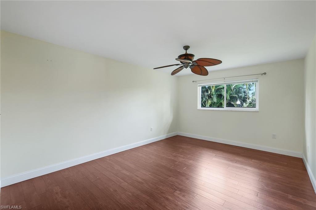 4160 Crayton Road, Unit A8 Naples, FL 34103 - Photo 18 of 26 a view of an empty room with a window