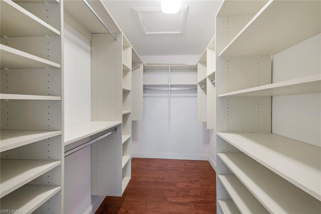 4160 Crayton Road, Unit A8 Naples, FL 34103 - Photo 21 of 26 a view of walk in closet with empty racks