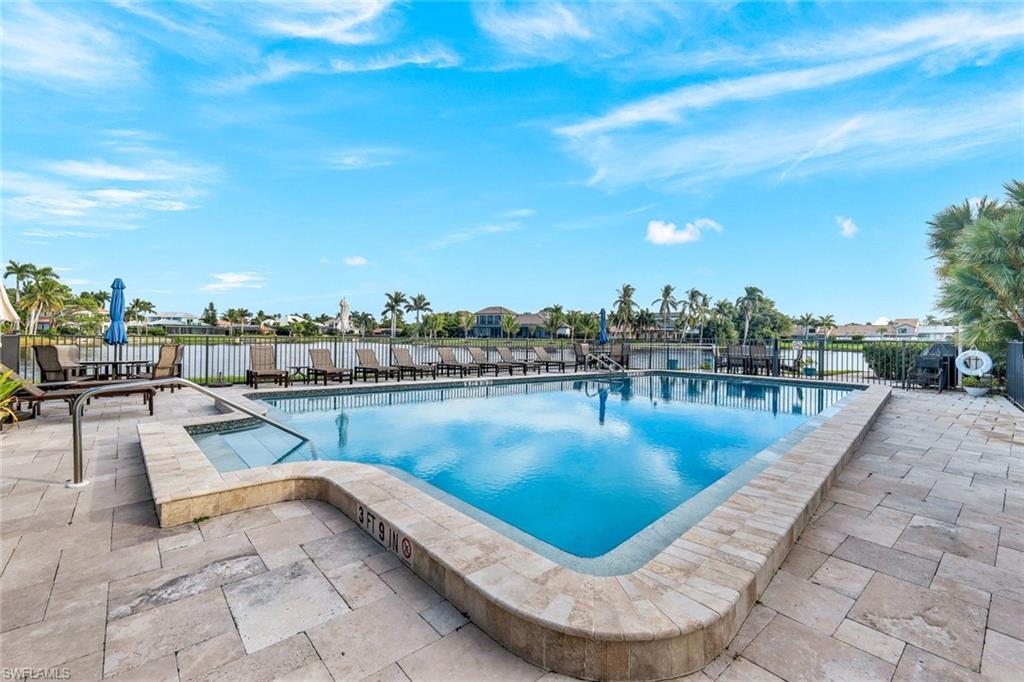 4160 Crayton Road, Unit A8 Naples, FL 34103 - Photo 3 of 26 a view of a swimming pool with outdoor seating