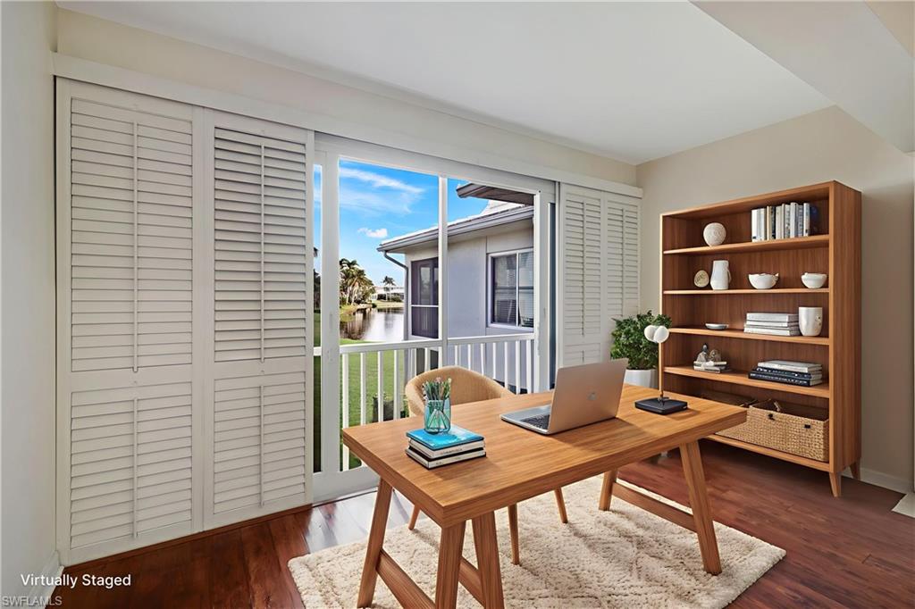 4160 Crayton Road, Unit A8 Naples, FL 34103 - Photo 5 of 26 a living room with furniture and a window