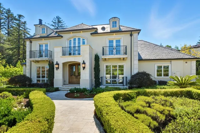 a front view of a house with a yard outdoor seating and yard