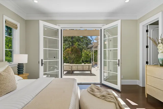 a kitchen with a table chairs stove and cabinets