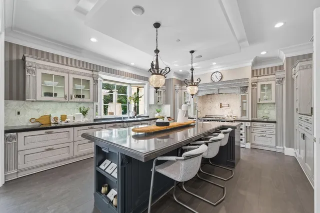 a kitchen with granite countertop a sink and a window