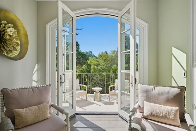 a spacious bathroom with a granite countertop sink and a mirror