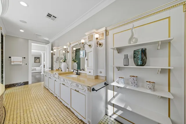 a bathroom with a granite countertop bathtub sink vanity and mirror