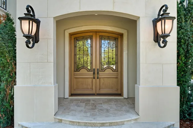 a living room with furniture a chandelier and a fireplace