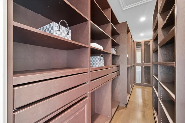 a view of an entryway with wooden floor and a front door