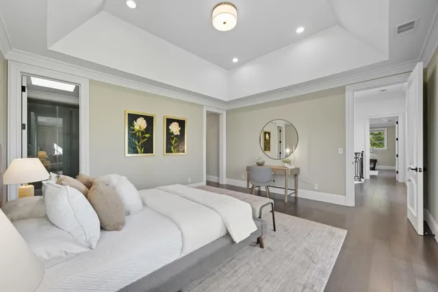 a front view of a house with swimming pool and outdoor seating