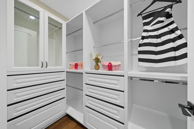a view of a patio with dining table and chairs with a small yard