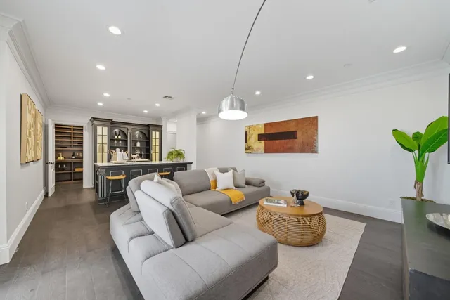 a front view of a house with a yard and a garage