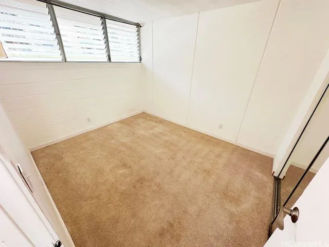 a view of a room that has a window