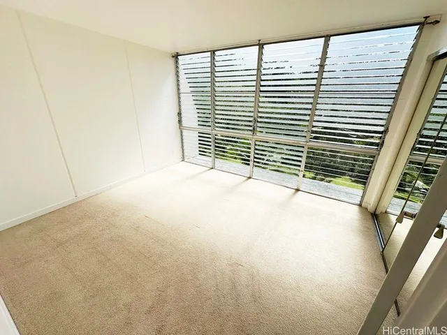 a view of a room with a large window