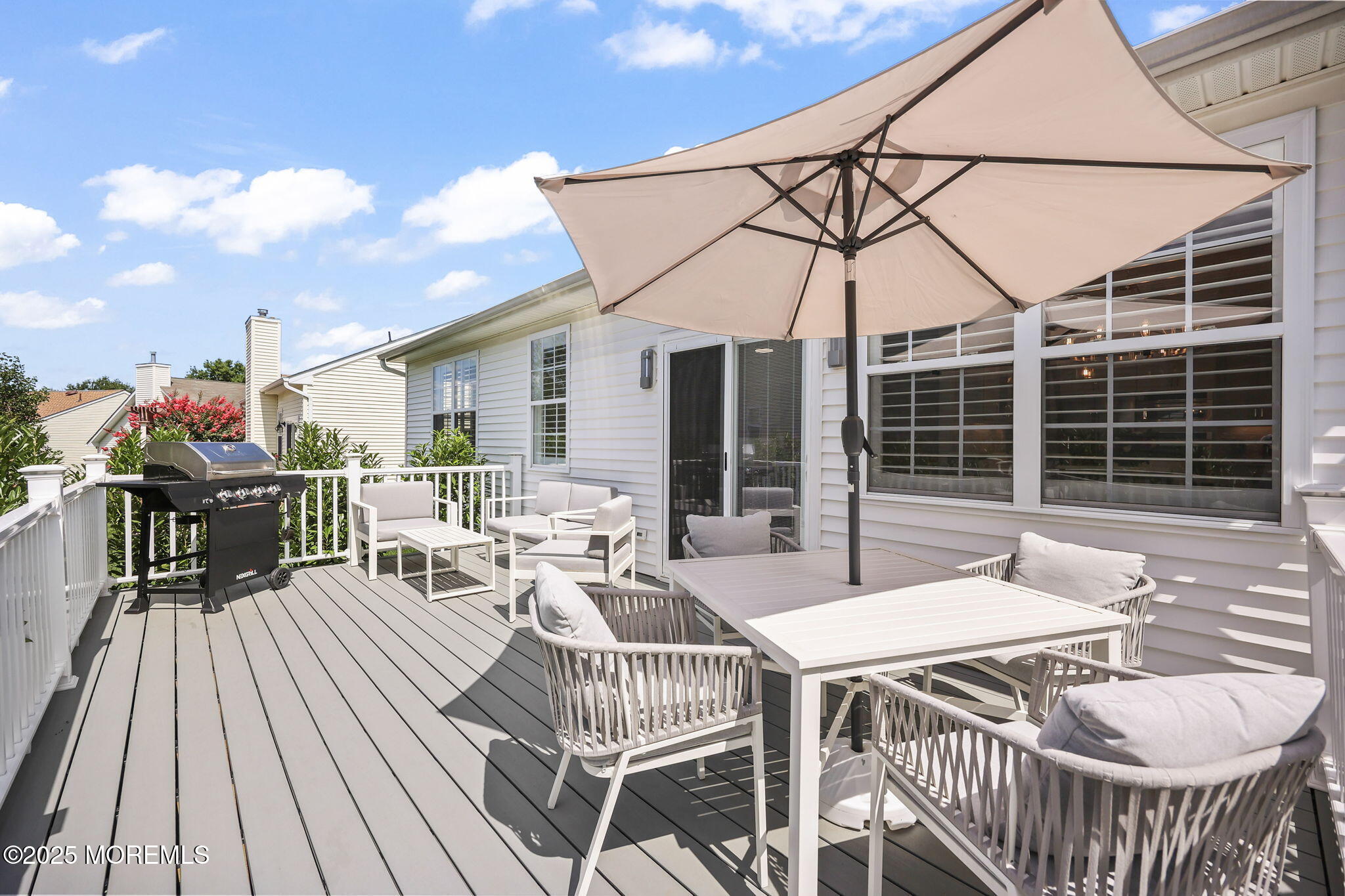 21 Silver Maple Lane Howell, NJ 07731 - Photo 17 of 22 a view of a patio with a dining table and chairs with wooden floor