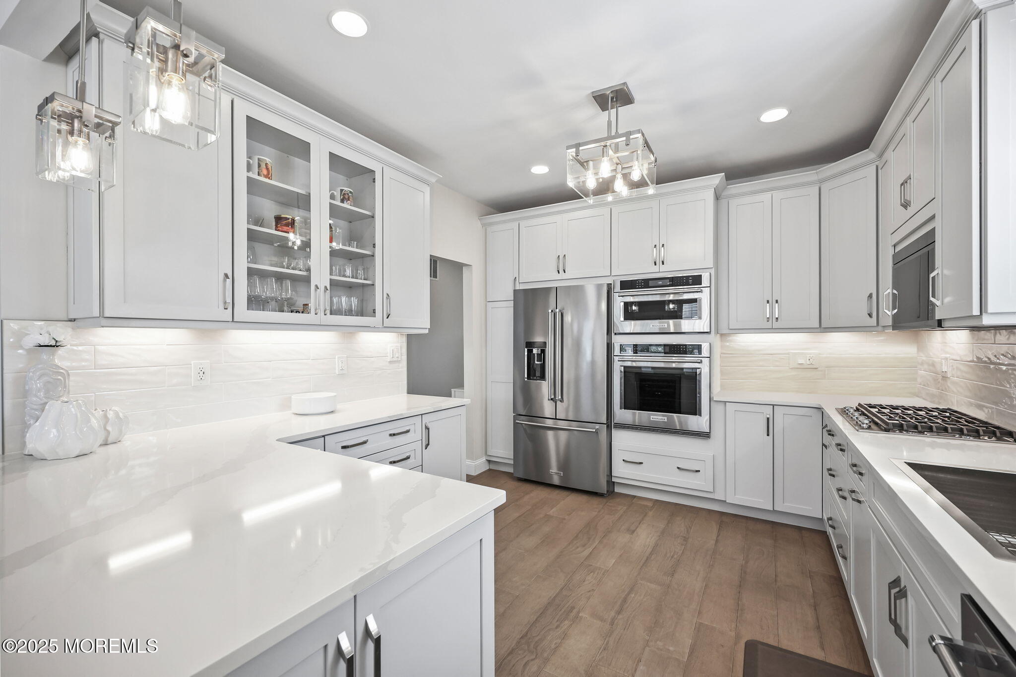 21 Silver Maple Lane Howell, NJ 07731 - Photo 8 of 22 a kitchen with stainless steel appliances a stove sink and cabinets