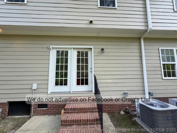 a front view of a house with a chair