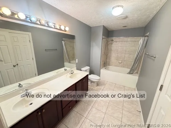 a spacious bathroom with a sink a mirror and a bathtub