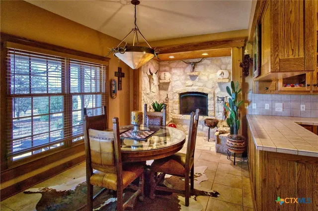 a living room with lots of furniture and a fireplace