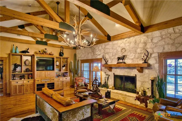 a living room with furniture and a floor to ceiling window