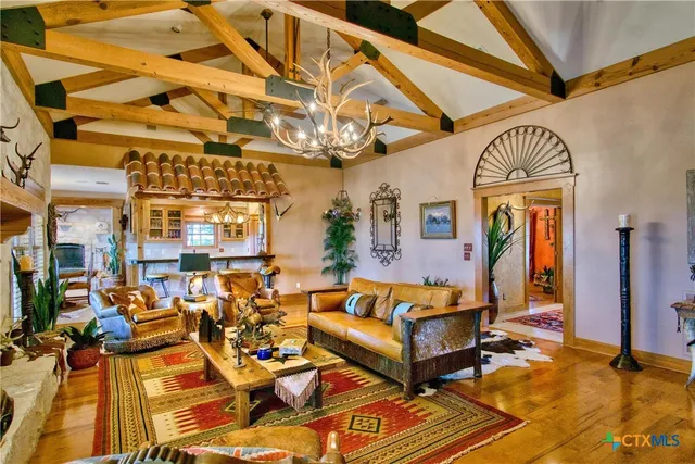 a bedroom with a bed dresser and a window