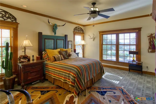 a bedroom with furniture and wooden floor