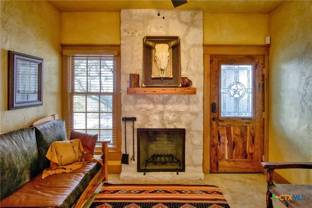 a bedroom with a bed next to a window with outer view
